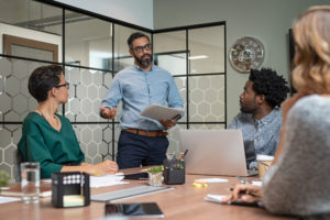 Group of workers discussing a project in a conference room.